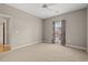 Carpeted bedroom featuring a ceiling fan and a window with light-filtering blinds at 138 Lumbee Circle # 17, Pawleys Island, SC 29585