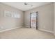 Cozy bedroom with carpet, a ceiling fan, and a bright window with patterned curtains at 138 Lumbee Circle # 17, Pawleys Island, SC 29585