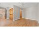 Neutral bedroom with hardwood floors, ceiling fan, and wood-toned closet doors at 138 Lumbee Circle # 17, Pawleys Island, SC 29585