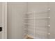 Walk-in closet with white wire shelving, offering ample storage at 138 Lumbee Circle # 17, Pawleys Island, SC 29585