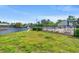 Scenic view of a pond with a fountain and community pool with chairs at 138 Lumbee Circle # 17, Pawleys Island, SC 29585