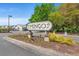 Sign at the entrance to Mingo community surrounded by lush landscaping at 138 Lumbee Circle # 17, Pawleys Island, SC 29585