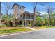 Stunning three-story home with double porches, manicured landscaping, and a charming coastal aesthetic at 138 Lumbee Circle # 17, Pawleys Island, SC 29585