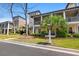 Charming two-story home with a porch, lush landscaping, and inviting curb appeal at 138 Lumbee Circle # 17, Pawleys Island, SC 29585