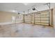 Open two-car garage with access doors and windows to the home's exterior at 138 Lumbee Circle # 17, Pawleys Island, SC 29585