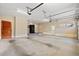 Large garage featuring a fridge and access doors to outside and inside at 138 Lumbee Circle # 17, Pawleys Island, SC 29585