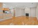 Bright living room featuring a fireplace, hardwood floors, and adjacent kitchen with stainless steel appliances at 138 Lumbee Circle # 17, Pawleys Island, SC 29585