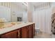 Bathroom with striped walls, cabinets, a large mirror, and vanity at 141 Wickham Ct., Pawleys Island, SC 29585