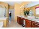 Well-lit bathroom offers double sinks, a soaking tub, and a walk-in shower at 141 Wickham Ct., Pawleys Island, SC 29585