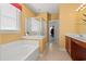 Well-lit bathroom offers a soaking tub and a walk-in shower at 141 Wickham Ct., Pawleys Island, SC 29585