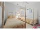 Bedroom with twin beds, wood frames, and neutral-toned bedding at 141 Wickham Ct., Pawleys Island, SC 29585