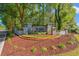Allston community entrance sign surrounded by lush landscaping, brick accents, and mature trees at 141 Wickham Ct., Pawleys Island, SC 29585