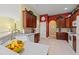 Well-lit kitchen features dark cabinetry and granite countertops and tile flooring at 141 Wickham Ct., Pawleys Island, SC 29585