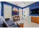 Living room with blue walls, built-in shelves, and an accent boat model at 141 Wickham Ct., Pawleys Island, SC 29585
