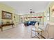Bright living room featuring tile floors, large windows, comfortable seating, and elegant decor at 141 Wickham Ct., Pawleys Island, SC 29585
