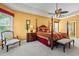 Spacious main bedroom featuring a four poster bed, sitting area, and neutral carpeting at 141 Wickham Ct., Pawleys Island, SC 29585