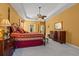 Spacious main bedroom featuring a four poster bed, sitting area, and neutral carpeting at 141 Wickham Ct., Pawleys Island, SC 29585