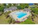 Aerial view of a large community pool with lounge chairs and surrounding palm trees at 141 Wickham Ct., Pawleys Island, SC 29585