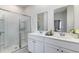 Bright bathroom with double vanity, quartz countertops, and glass-enclosed shower at 1419 Nokota Dr., Conway, SC 29526