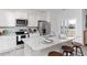 Bright kitchen featuring stainless steel appliances, a granite countertop island with seating and a lake view at 1439 Nokota Dr., Conway, SC 29526