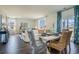 Bright dining area with a modern table, wicker chairs, and elegant blue and white patterned curtains at 1447 Nokota Dr., Conway, SC 29526