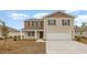Charming two-story home with a neutral color scheme, a front porch, and an attached two-car garage at 1447 Nokota Dr., Conway, SC 29526