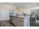 Bright kitchen island featuring gray cabinets, granite countertops and stainless steel dishwasher at 1447 Nokota Dr., Conway, SC 29526