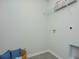 Empty laundry room with tile floors, white walls and a utility sink on the bottom right at 1447 Nokota Dr., Conway, SC 29526