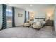 Serene primary bedroom showcasing a luxurious bed, and ample natural light from the large windows at 1447 Nokota Dr., Conway, SC 29526