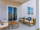 Cozy covered patio with comfortable seating, perfect for relaxation and outdoor enjoyment at 1447 Nokota Dr., Conway, SC 29526