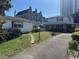 Property showing lawn and driveway, with a building in the background on a clear day at 1504 Chester St., Myrtle Beach, SC 29577