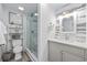Well-lit bathroom featuring a modern vanity, glass-enclosed shower, and stylish decor at 1512 S Ocean Blvd., North Myrtle Beach, SC 29582