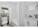 Clean and modern bathroom with a shower/tub combo, vanity, and a window providing natural light at 1512 S Ocean Blvd., North Myrtle Beach, SC 29582