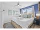 Bright and cozy bedroom with a comfortable bed, stylish decor, and ample natural light from the windows at 1512 S Ocean Blvd., North Myrtle Beach, SC 29582