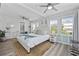 Bright bedroom with ample natural light, light wood floors, and white furniture at 1512 S Ocean Blvd., North Myrtle Beach, SC 29582
