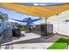 A modern hot tub is in the fenced backyard with a grill and lounge chairs on the patio at 1512 S Ocean Blvd., North Myrtle Beach, SC 29582
