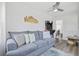 Comfortable living room with a gray sofa, gaming console, and Myrtle Beach themed decor at 1512 S Ocean Blvd., North Myrtle Beach, SC 29582