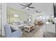 Inviting living room featuring stylish decor, comfortable seating, ceiling fans, and a view to the dining area at 1512 S Ocean Blvd., North Myrtle Beach, SC 29582