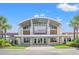 Front of Aquatic & Fitness Center featuring a barrel roof, brick columns and green spaces at 1513 Anne St., North Myrtle Beach, SC 29582