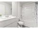 Bright bathroom featuring a shower and tub combination with a white sink and cabinet at 154 Seasons Trace Loop, Longs, SC 29568