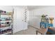 Hallway with two white doors, a blue cabinet, planted aquarium and a storage shelf with various items at 154 Seasons Trace Loop, Longs, SC 29568