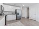 Spacious kitchen with stainless steel appliances, white cabinets, granite countertops, and adjacent doorways at 154 Seasons Trace Loop, Longs, SC 29568