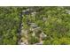 Birds eye shows home surrounded by dense, green trees and foliage, creating a secluded and private setting at 1651 Weldon Ln., Conway, SC 29526