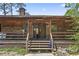 Charming home with a rustic wood exterior, a covered porch, and a welcoming entrance with decorative accents at 1651 Weldon Ln., Conway, SC 29526