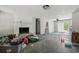Spacious living room with a brick fireplace, a ceiling fan, and sliding glass doors to the outdoor area at 1651 Weldon Ln., Conway, SC 29526