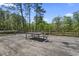 Large wooden deck with a dining table and chair, great for enjoying the outdoors in style and comfort at 1651 Weldon Ln., Conway, SC 29526