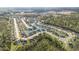 Aerial view of a Gathering-friendly community with homes surrounding a tranquil pond at 180 Oak Crest Circle, Longs, SC 29568