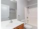 Bathroom featuring a wood vanity, ample mirror, and shower-tub combination at 180 Oak Crest Circle, Longs, SC 29568