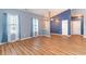 Bright, open living room features hardwood floors, vaulted ceiling and lots of natural light at 180 Oak Crest Circle, Longs, SC 29568