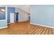 Bright, open living room features hardwood floors, vaulted ceiling and lots of natural light at 180 Oak Crest Circle, Longs, SC 29568